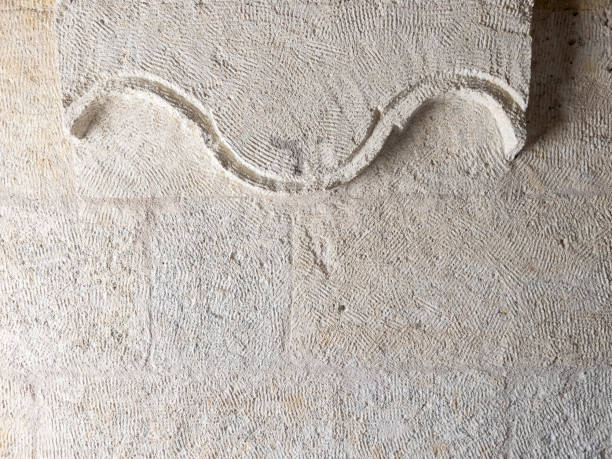 Interesting curvy design symbol carved on stone on a wall in Goreme Nevsehir stock photo