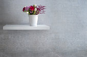 istock Interior design shelf with flower vase 1319986241