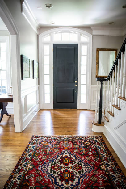 Interior front door hall hallway entrance to Home with Vaulted Ceilings Interior front door hall hallway entrance to Home with Vaulted Ceilings rug stock pictures, royalty-free photos & images