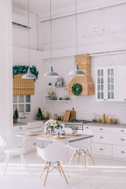 Interior of a bright modern kitchen in vintage style, decorated with Christmas decor stock photo