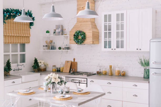 Interior of a bright modern kitchen in vintage style, decorated with Christmas decor stock photo