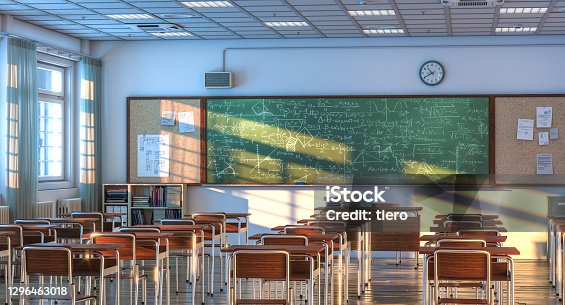istock interior of a school classroom with wooden desks and chairs. 1296463018
