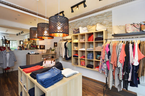 Interior of a store selling women's clothes and accessories Interior shot of a fashion boutique. Selling women's clothes and accessories. Small business. department store photos stock pictures, royalty-free photos & images