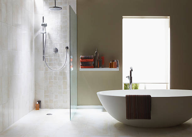 Interior of bathroom in cool green with a running shower stock photo