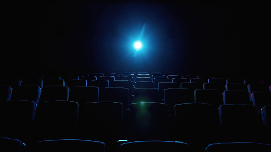 Interior of movie theater with empty red seats and projector. Web Banner