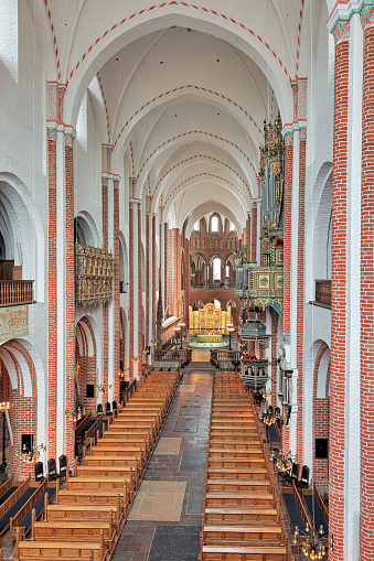 Roskilde, Denmark - December 14, 2015: Interior of Roskilde Cathedral. Since the Protestant Reformation in 16th century all Danish kings and almost all queens have been buried in Roskilde Cathedral. The cathedral was listed as a UNESCO World Heritage Site in 1995.