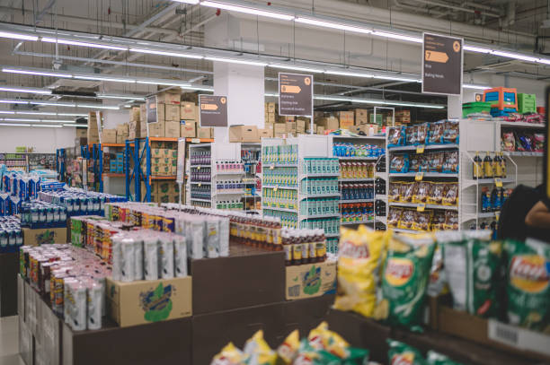 interior of supermarket full of grocery items in rows with shelf displayed interior of supermarket chain store stock pictures, royalty-free photos & images