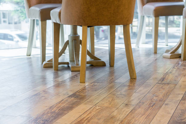 interior of the cafe legs of chairs on the wooden floor of the restaurant, close-up wood laminate flooring stock pictures, royalty-free photos & images