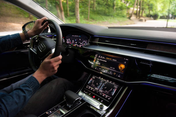 Interior of the new 2018 Audi A8 50 TDI quattro on the street. New 2018 Audi A8 50 TDI quattro on the street. Black Audi A8 2018 edition. Brand new car. Interior of the car. audi photos stock pictures, royalty-free photos & images