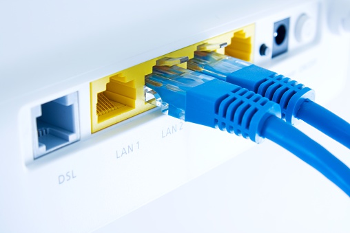 close up of a lan switch with pluged in cables,