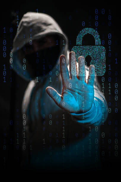Internet crime concept. Hacker working on a code on dark digital background stock photo
