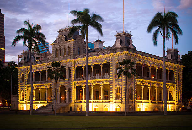 Iolani Palace at night in Honolulu, HI stock photo