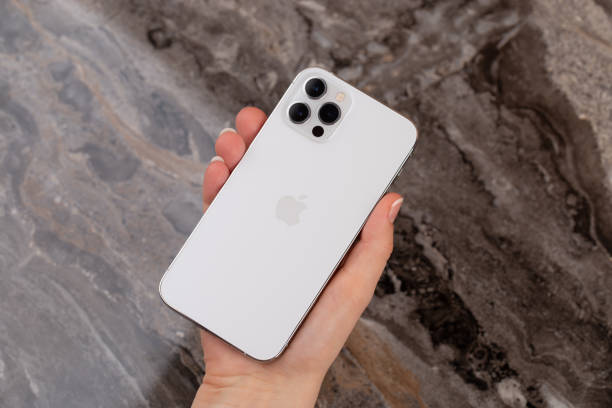 iPhone 12 Pro in hand. New smartphone from Apple company in hand close-up. Rostov-on-Don, Russia - February 2021. iPhone 12 Pro in hand. New smartphone from Apple company in hand close-up. iphone stock pictures, royalty-free photos & images