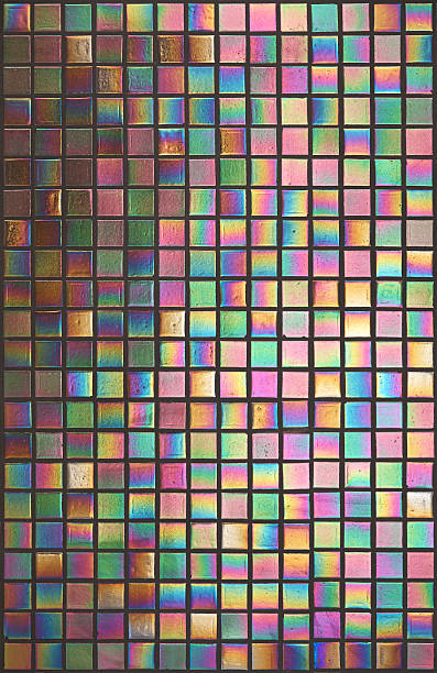 iridescent mosaic tiles Iridescent metalised mosaic tiles, also known as Iridium Iridescent tiles with their multi-coloured reflective nature. Often used in bathrooms, swimming pools or wet areas, these tiles have a characteristic metallic sheen with rainbow colour effects. A little shadow has been allowed to the left to emphasise the reflective nature of the tiles. iridium stock pictures, royalty-free photos & images