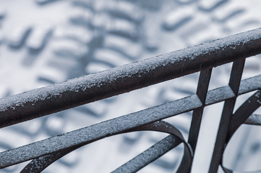 iron fence covered with snow