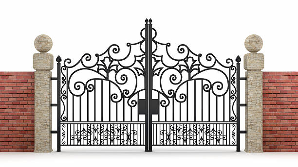 Iron gate Black ornamented iron gate with walls isolated on white. Clipping path included. gate stock pictures, royalty-free photos & images