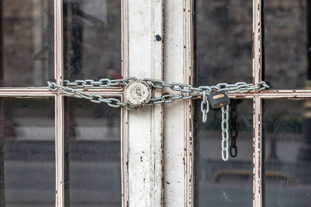 Iron lock and chain on door stock photo