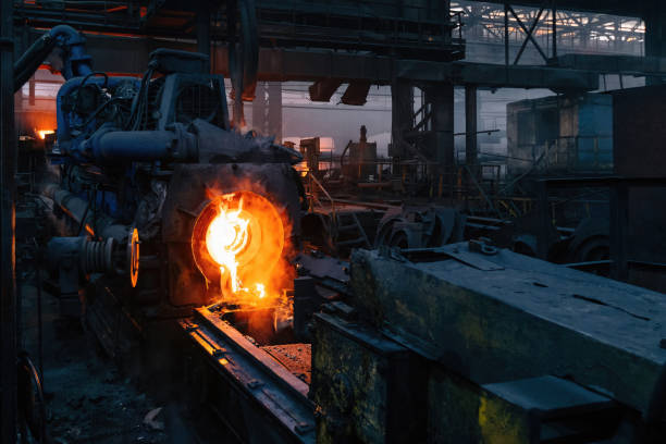 Iron pipe centrifugal pipe casting machine at the foundry stock photo