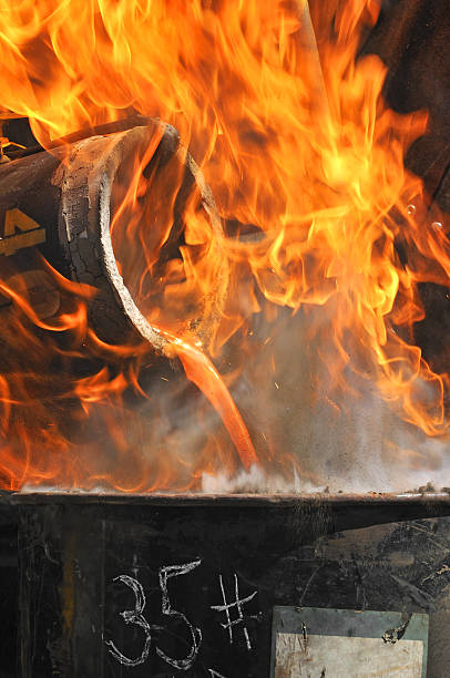 Iron Pour - 35 Pound Mold Explodes in Flames stock photo