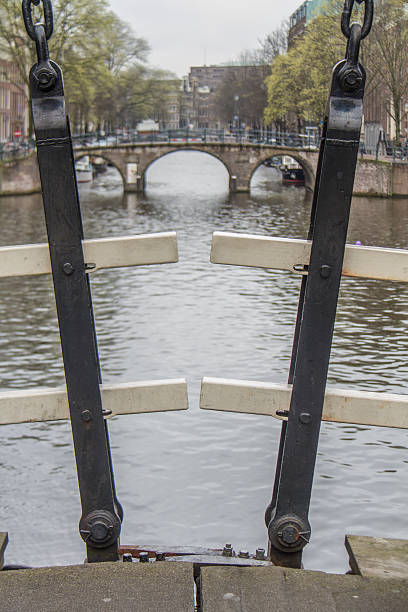 Iron Straps on Amsterdam bridge stock photo