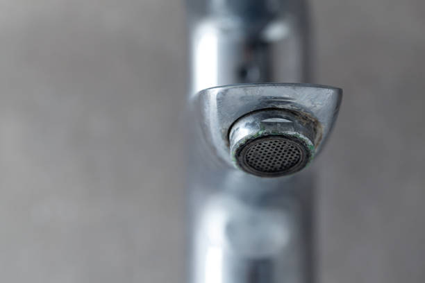 irty rusty faucet with limescale stock photo