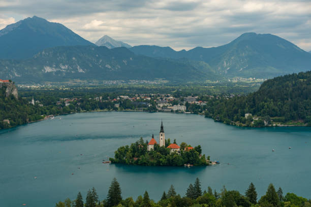 Island on lake in Bled town in Slovenia in cloudy summer day stock photo