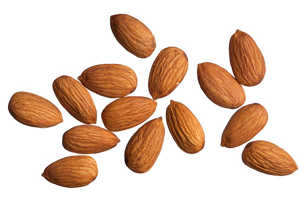 Isolated Almonds Raw almonds isolated on white. almond photos stock pictures, royalty-free photos & images