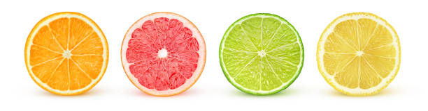 Isolated citrus halves Isolated citrus slices. Fresh fruits cut in half (orange, pink grapefruit, lime, lemon) in a row isolated on white background with clipping path citrus fruit stock pictures, royalty-free photos & images