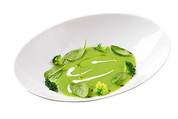 isolated image of green pea soup with broccoli stock photo