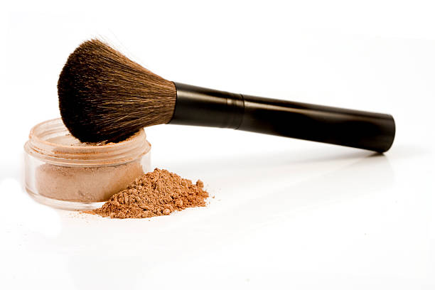 Isolated mineral make-up with brush stock photo