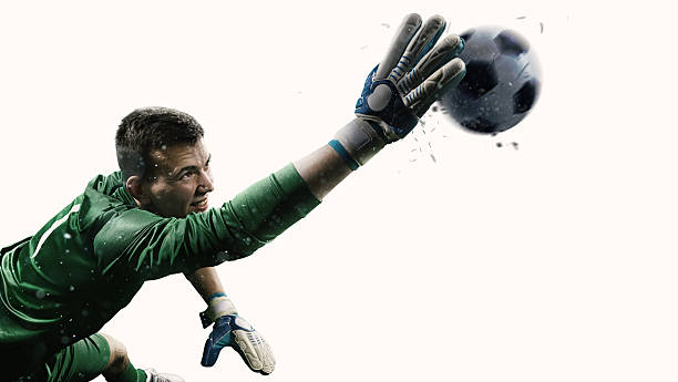 Isolated professional soccer goalkeeper in action Isolated professional soccer goalkeeper in action. A player wears unbranded soccer uniform. goalie stock pictures, royalty-free photos & images