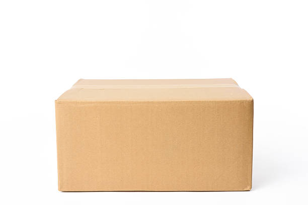 Isolated shot of closed rectangular cardboard box on white background stock photo