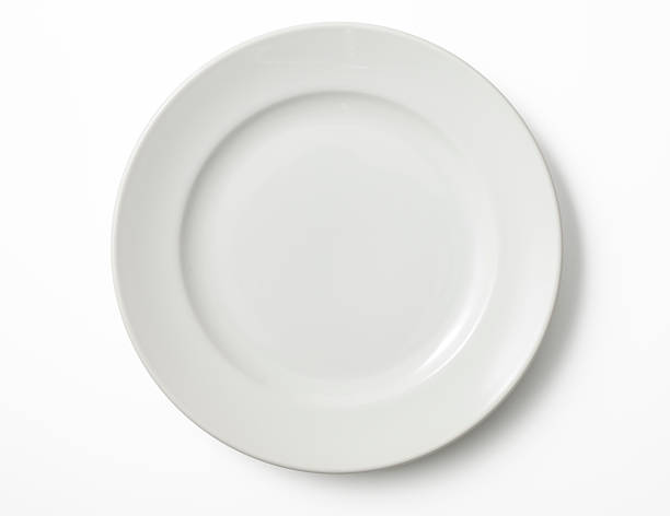 Isolated shot of empty white plate on white background stock photo
