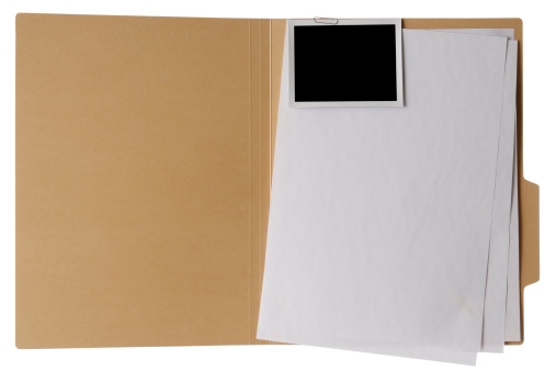 Opened brown file folder, stacked blank documents with blank photo attached isolated on white background with Clipping path.