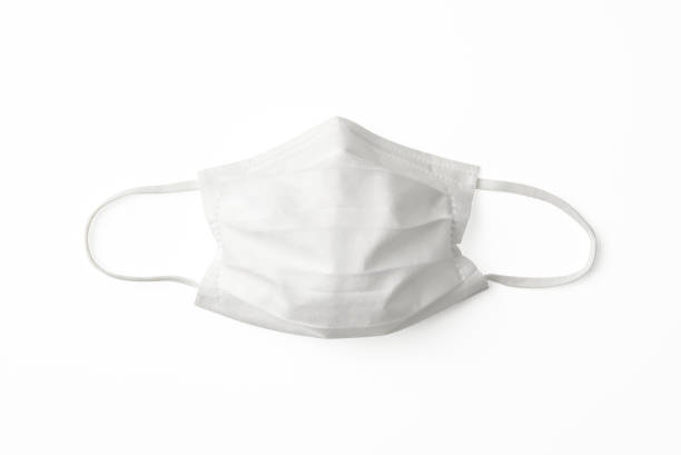 Isolated shot of protective face mask on white background Overhead shot of protective face mask, isolated on white with clipping path. surgical mask stock pictures, royalty-free photos & images