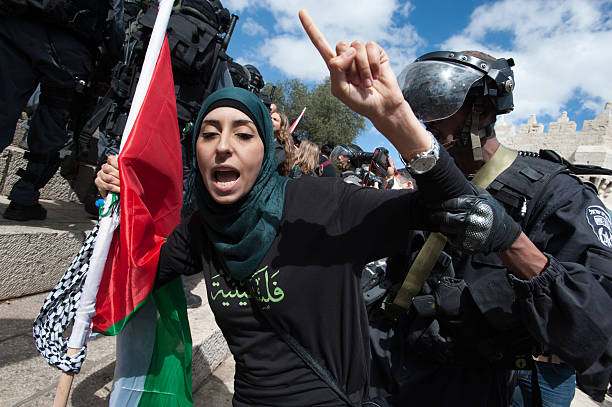 Israeli police arrest Palestinian woman stock photo