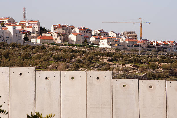 Israeli separation wall and settlement stock photo