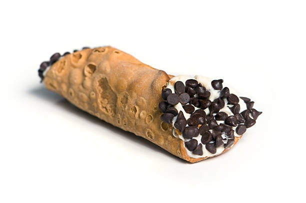 Italian Dessert Cannoli Pastry w/ Chocolate Chips Italian Dessert Cannoli Pastry w/ Chocolate Chips isolated on white background cannoli stock pictures, royalty-free photos & images