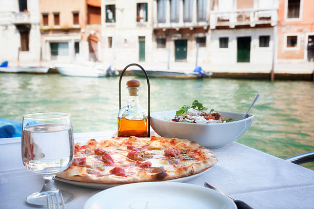 What could be more Italian!  A pizza meal and salad on one of the canals of Venice.