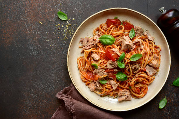 Italian pasta spaghetti with tuna in tomato sauce stock photo