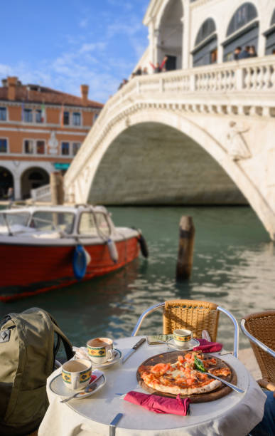 Italian Pizza on table at Rialto Bridge in Venice, Italy stock photo