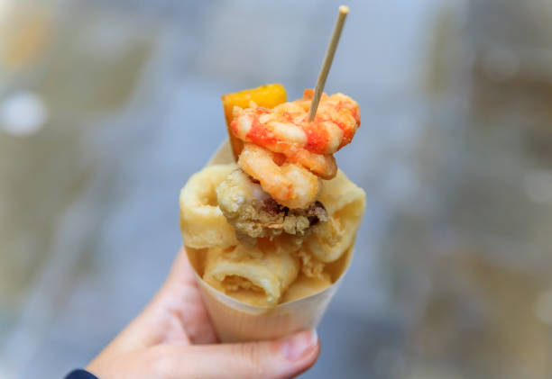 Italian street food in Venice - fritto misto in a cone stock photo