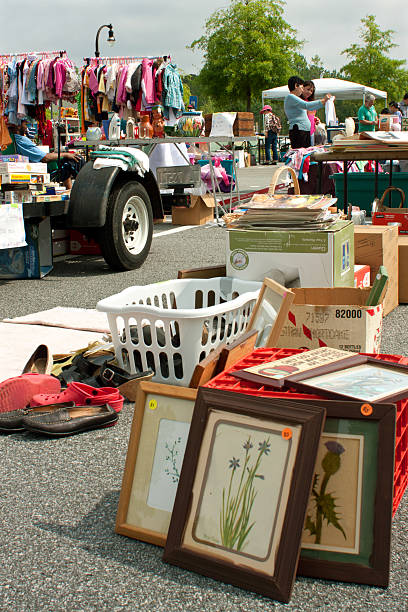 Items On Display In Citywide Garage Sale "Lilburn, GA, USA - April 21, 2012:  Several items fill up  a parking lot adjacent to city hall at the Lilburn citywide garage sale." thrift store photos stock pictures, royalty-free photos & images