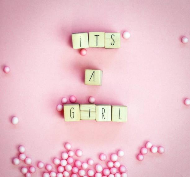 Its a Girl text written with wooden cubes on pastel white background top view, Baby announcement. Flat lay,text space. Greeting card, shower, baby concept bright colorful design Its a Girl text written with wooden cubes on pastel white background top view, Baby announcement. Flat lay,text space. Greeting card, shower, baby concept bright colorful design cute it's a girl stock pictures, royalty-free photos & images