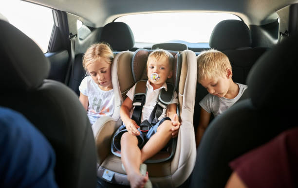 Its been a long journey Shot of children sleeping in the backseat of a car back seat stock pictures, royalty-free photos & images
