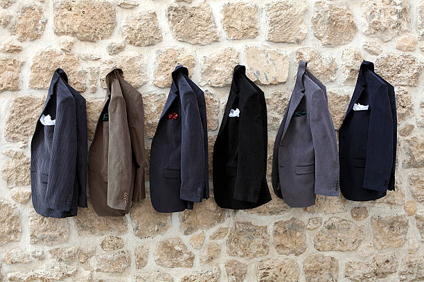 Jackets hanging on wall Jackets with pocket handkerchiefs. men's fashion stock pictures, royalty-free photos & images