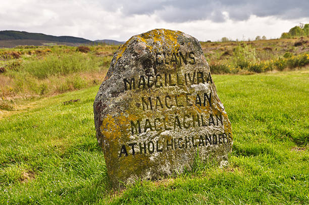 Jacobite Gravestone at Culloden, Scotland Taken on the battlefield of Culloden in Inverness Scotland. A headstone marks the area where several Jacobite clans died in the Battle of Culloden 1746 against the British. battlefield stock pictures, royalty-free photos & images