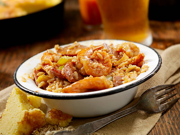 Jambalaya "Creole Style Shrimp and Sausage Jambalaya with Hot sauce, corn bread and a Beer- Photographed on Hasselblad H3D2-39mb Camera" gumbo stock pictures, royalty-free photos & images