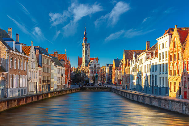 Jan Van Eyck Square and Spiegelrei in Bruges Scenic cityscape with canal Spiegelrei and Jan Van Eyck Square in the morning in Bruges, Belgium brugge, belgium stock pictures, royalty-free photos & images