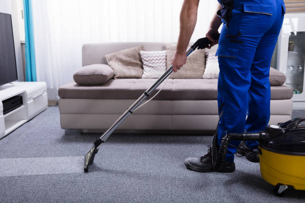 Janitor Cleaning Carpet Janitor's Hand Cleaning Carpet With Vacuum Cleaner carpet cleaning stock pictures, royalty-free photos & images